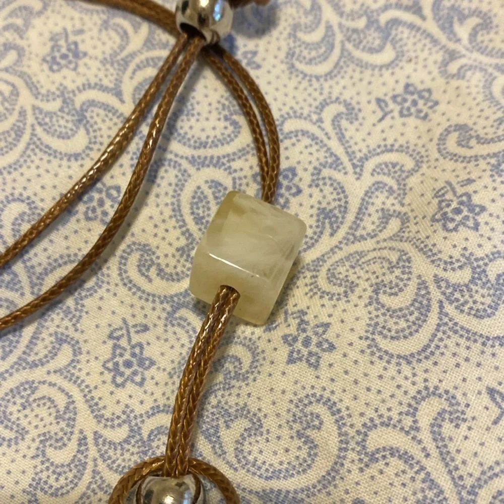Very cool handmade necklace with beads, stone and seashell.